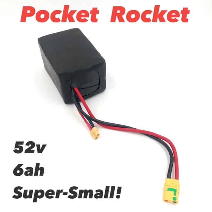 A small battery is attached to the side of a pocket rocket.