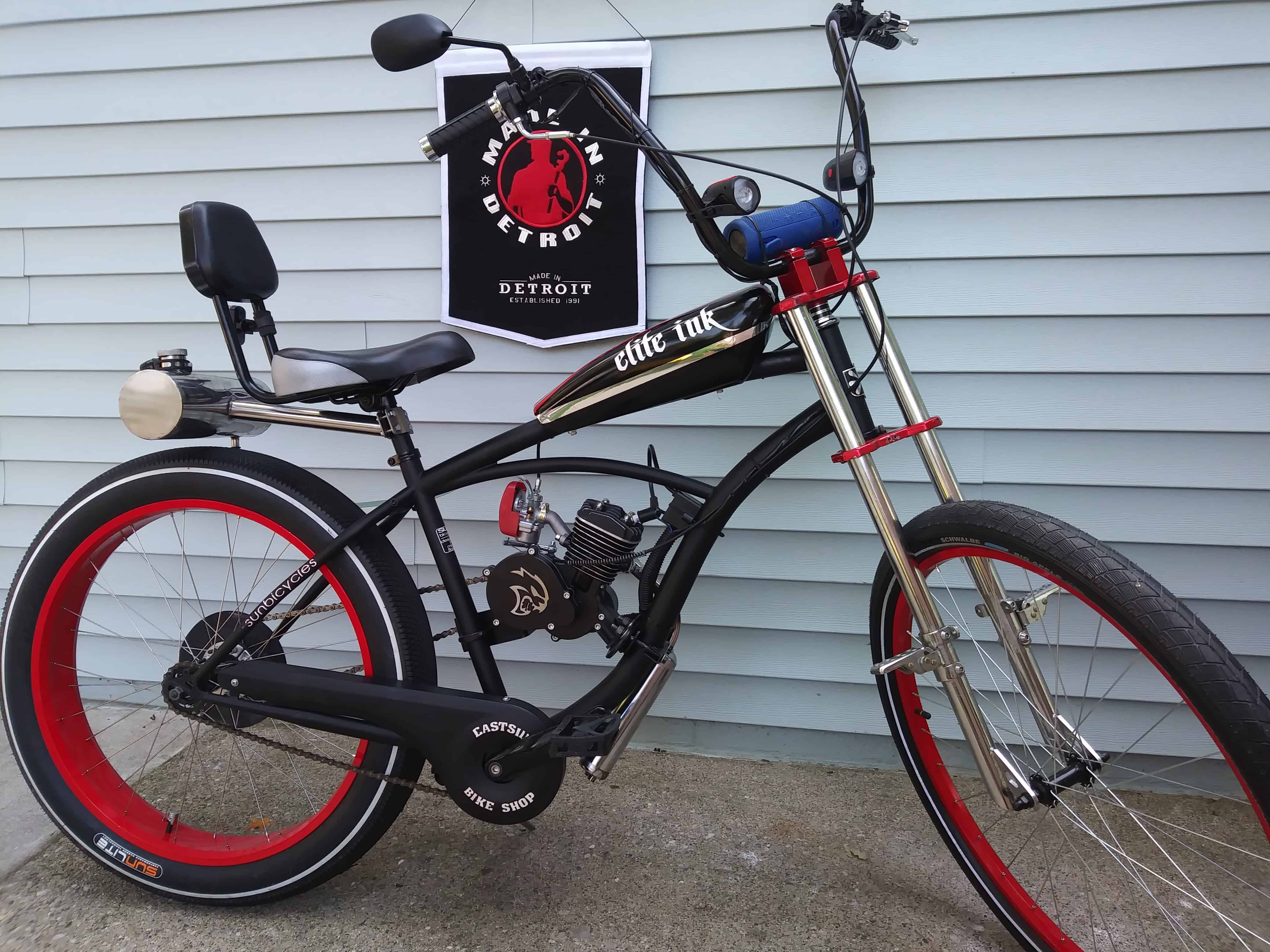 A red and blue logo for bicycle motor works.