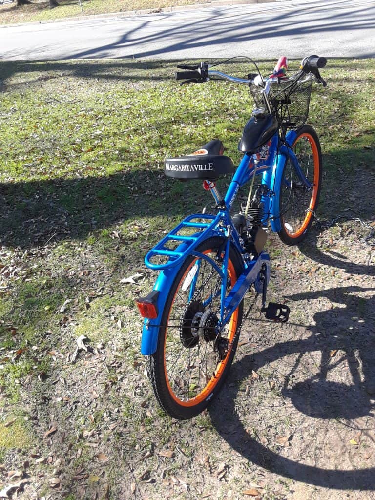 A red and blue logo for bicycle motor works.