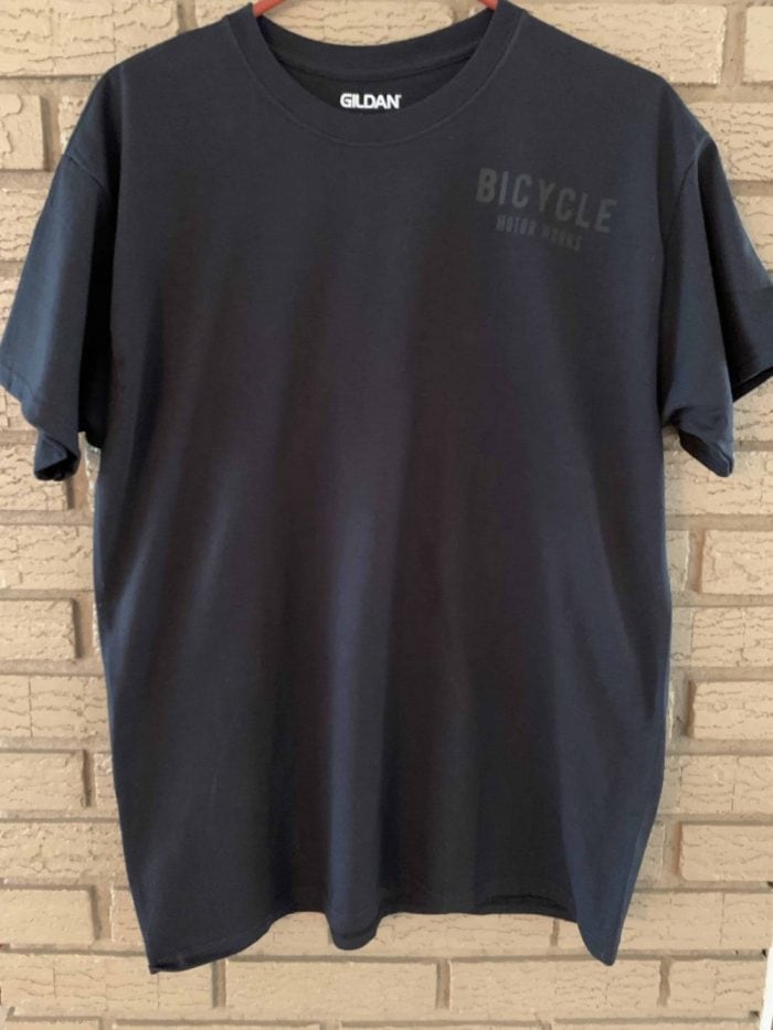 A black shirt with the word bicycle written on it.