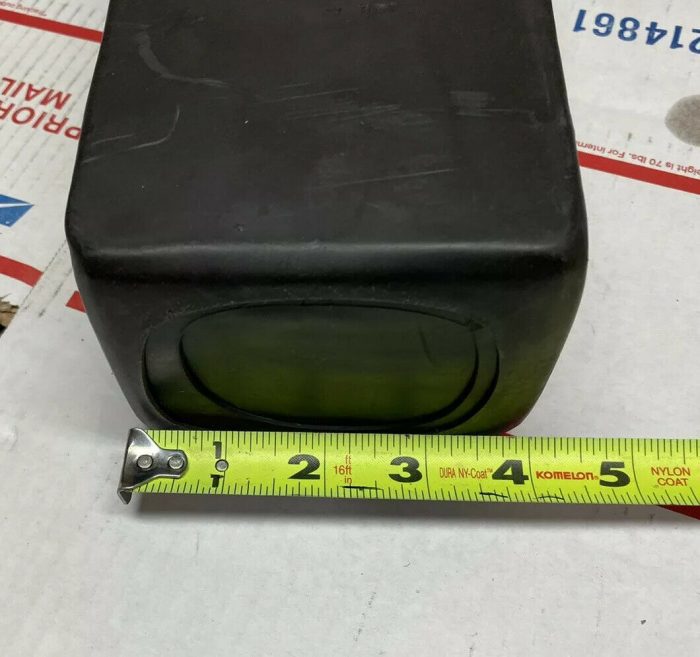 A measuring tape is next to the small box.