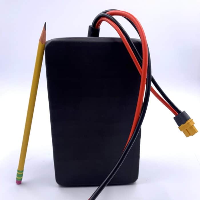 A black box with wires and an electrical cord